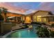 Inviting backyard with a pristine pool, covered patio, and outdoor kitchen, perfect for entertaining and relaxation at 4450 S Frequency --, Mesa, AZ 85212
