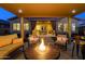 Cozy outdoor space with a fire pit, comfortable seating, and covered patio, creating the perfect ambiance for relaxation at 4450 S Frequency --, Mesa, AZ 85212