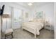 Bright bedroom featuring a four-poster bed, neutral decor, and shuttered windows for natural light at 4450 S Frequency --, Mesa, AZ 85212
