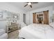 Bright primary bedroom with a sliding barn door to the en-suite bathroom at 4450 S Frequency --, Mesa, AZ 85212