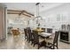 Bright dining room with wood beam ceilings, plantation shutters, and a large wooden table at 4450 S Frequency --, Mesa, AZ 85212