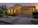 Inviting home featuring a well-maintained lawn, brick driveway, and a two-car garage, offering great curb appeal at 4450 S Frequency --, Mesa, AZ 85212