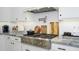 Kitchen with white subway tile backsplash, stainless steel range and fixtures at 4450 S Frequency --, Mesa, AZ 85212