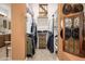 Well-organized walk-in closet featuring custom shelves, drawers, and rods for ample storage at 4450 S Frequency --, Mesa, AZ 85212