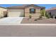 Charming single-story home with a well-maintained yard and attached two-car garage in a residential neighborhood at 48171 N La Soledad --, Gold Canyon, AZ 85118