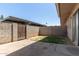 Small backyard with a concrete patio and block wall fencing at 5742 N 43Rd Dr, Glendale, AZ 85301