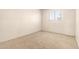 Simple bedroom featuring carpet floors, a window and neutral walls at 5742 N 43Rd Dr, Glendale, AZ 85301