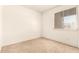 Comfortable bedroom with carpet floors, a bright window, and light-colored walls at 5742 N 43Rd Dr, Glendale, AZ 85301