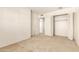 Carpeted bedroom with a closet and access to an additional closet at 5742 N 43Rd Dr, Glendale, AZ 85301