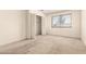 Carpeted bedroom featuring a window and closet space at 5742 N 43Rd Dr, Glendale, AZ 85301