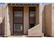 Two-story townhome with a stucco facade, contrasting brown trim, and a neatly kept walkway to the front door at 5742 N 43Rd Dr, Glendale, AZ 85301