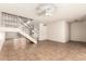 Bright living room with tiled floors, a ceiling fan, and a staircase leading to the upper level at 5742 N 43Rd Dr, Glendale, AZ 85301