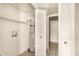 Small utility room with a water heater and open access to additional storage at 5742 N 43Rd Dr, Glendale, AZ 85301