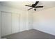 This bedroom features a closet and modern ceiling fan at 6813 W Sherri Jean Ln, Peoria, AZ 85382