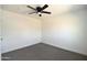 This bedroom boasts a modern ceiling fan and neutral carpet at 6813 W Sherri Jean Ln, Peoria, AZ 85382