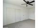 This bedroom features a closet and modern ceiling fan at 6813 W Sherri Jean Ln, Peoria, AZ 85382