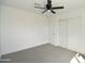 Spacious bedroom with a sliding door closet and neutral carpet at 6813 W Sherri Jean Ln, Peoria, AZ 85382