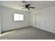 This bedroom features a window and closet for storage at 6813 W Sherri Jean Ln, Peoria, AZ 85382