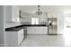 Bright, updated kitchen with stainless steel appliances and black countertops at 6813 W Sherri Jean Ln, Peoria, AZ 85382