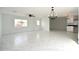 Open floor plan living room with marble tile flooring and lots of natural light at 6813 W Sherri Jean Ln, Peoria, AZ 85382