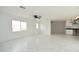 A bright living room with stylish marble floors offers a clean, modern aesthetic at 6813 W Sherri Jean Ln, Peoria, AZ 85382