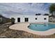 Backyard with an in-ground pool and concrete patio, ideal for outdoor relaxation and entertaining at 6813 W Sherri Jean Ln, Peoria, AZ 85382