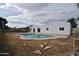 Backyard view showcasing the pristine in-ground pool and modern design of the home's exterior at 6813 W Sherri Jean Ln, Peoria, AZ 85382
