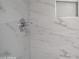 Close up of shower featuring a niche, and marble tile at 6813 W Sherri Jean Ln, Peoria, AZ 85382