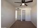 Bedroom features closet, door and carpet flooring at 720 S Dobson Rd # 24, Mesa, AZ 85202