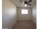 Bright bedroom with neutral carpet and a ceiling fan with a light at 720 S Dobson Rd # 24, Mesa, AZ 85202