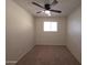 A cozy bedroom features neutral walls, carpet flooring, and a ceiling fan at 720 S Dobson Rd # 24, Mesa, AZ 85202