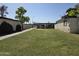 Exterior view of a community with covered parking and well-maintained grass at 720 S Dobson Rd # 24, Mesa, AZ 85202