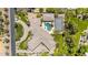 Aerial view highlights the pool, tennis court, manicured landscaping, and sprawling roofline of this luxury property at 7272 N 71St St, Paradise Valley, AZ 85253