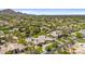 Extensive aerial view showcasing a tennis court, pool, guesthouse, and well-manicured landscaping in this luxury estate at 7272 N 71St St, Paradise Valley, AZ 85253