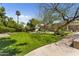 Expansive backyard featuring lush lawn and mature trees, creating a serene outdoor living space at 7272 N 71St St, Paradise Valley, AZ 85253