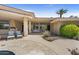 Backyard seating area with outdoor kitchen and grill with lush landscaping surrounding the pool at 7272 N 71St St, Paradise Valley, AZ 85253