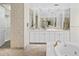Bathroom with double vanities, large mirror, and jacuzzi tub at 7272 N 71St St, Paradise Valley, AZ 85253