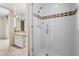 This bathroom features a glass shower and a vanity with a mirror and under-sink storage at 7272 N 71St St, Paradise Valley, AZ 85253