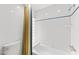 Clean and functional bathroom with tiled walls, a shower curtain, and essential fixtures at 7272 N 71St St, Paradise Valley, AZ 85253