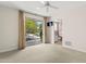 Bedroom features a sliding glass door, TV, and an en-suite bathroom at 7272 N 71St St, Paradise Valley, AZ 85253
