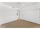 Bright, empty bedroom with neutral carpet, ceiling fan, and closet, offering a simple, serene space at 7272 N 71St St, Paradise Valley, AZ 85253