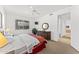 Well-lit bedroom with a window view, a decorative mirror, and carpet flooring at 7272 N 71St St, Paradise Valley, AZ 85253