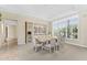Elegant dining room with a coffered ceiling, a large window, and a glimpse into the kitchen at 7272 N 71St St, Paradise Valley, AZ 85253