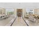 Grand foyer with marble floors, high ceilings, a dining table, and natural light streaming through shuttered windows at 7272 N 71St St, Paradise Valley, AZ 85253