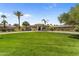 Expansive lawn and lush landscaping surround this luxury home at 7272 N 71St St, Paradise Valley, AZ 85253