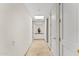 Bright hallway with recessed lighting and a decorative niche with flowers at 7272 N 71St St, Paradise Valley, AZ 85253