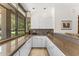 Well-lit kitchen with granite countertops, sink, and cabinets under large windows offering outdoor views at 7272 N 71St St, Paradise Valley, AZ 85253