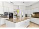 Well-equipped kitchen with island, stainless steel appliances, white cabinetry, and granite countertops at 7272 N 71St St, Paradise Valley, AZ 85253