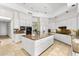 Modern white kitchen with a center island, sleek cabinetry, and high-end appliances at 7272 N 71St St, Paradise Valley, AZ 85253