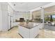 Modern kitchen with a central island, stainless steel appliances, and views of the backyard at 7272 N 71St St, Paradise Valley, AZ 85253